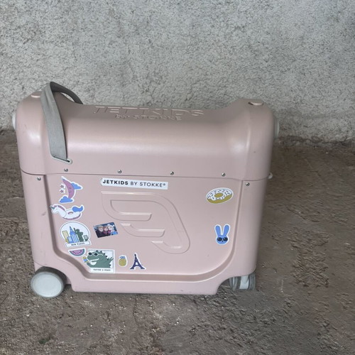 Stokke pink suitcase used with broken wheel part
