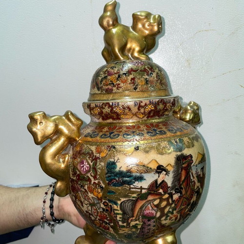 Ancient gilded vase with broken handle