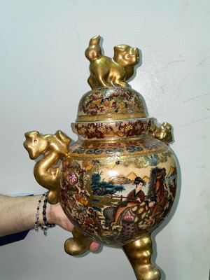 Ancient gilded vase with broken handle