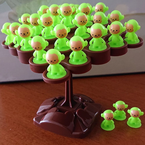 Mini balance board game on a tree with monkeys like new