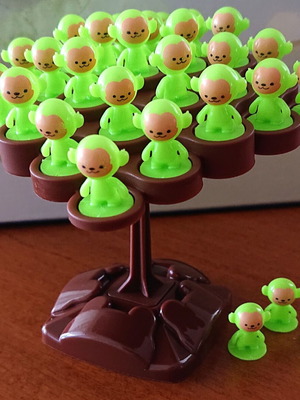 Mini balance board game on a tree with monkeys like new