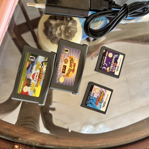 Nintendo DS used with 5 game cartridges and charger