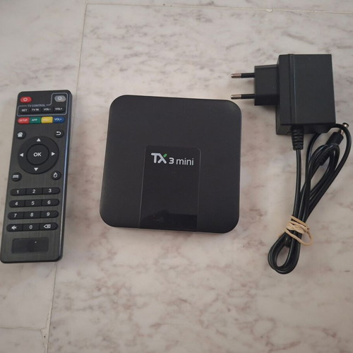 Tanix TX3 Mini Android TV Box used with remote and HDMI cable