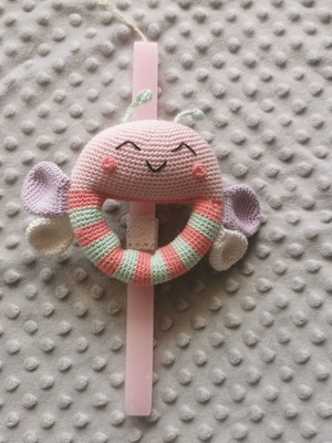Candle with knitted butterfly rattle