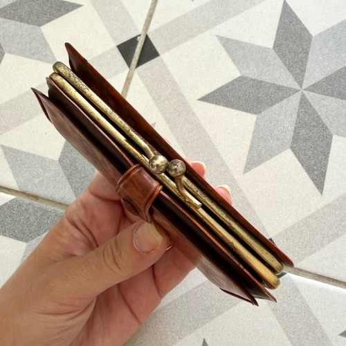 Vintage brown leather wallet used with frame closure