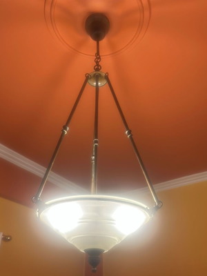 Pendant light with glass shade and bronze details used