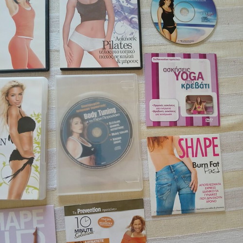 9 DVDs with fitness, pilates, wellness and yoga programs like new