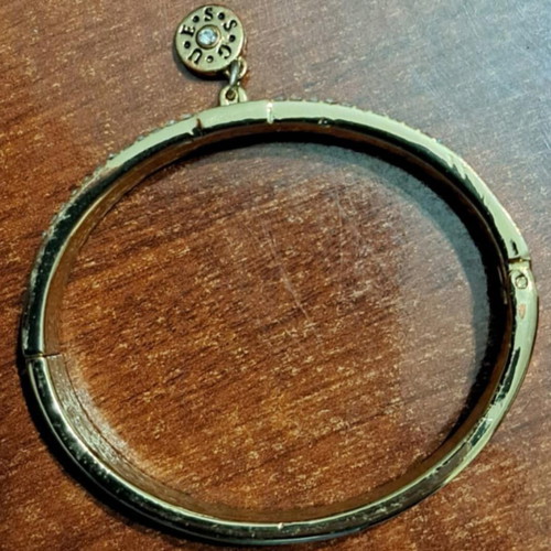 Guess women's bracelet, gold plated with missing stones