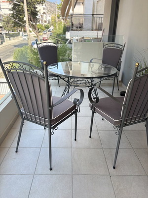 Outdoor dining set used, iron with cushions