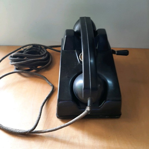Antique telephone with crank used, 1920-30