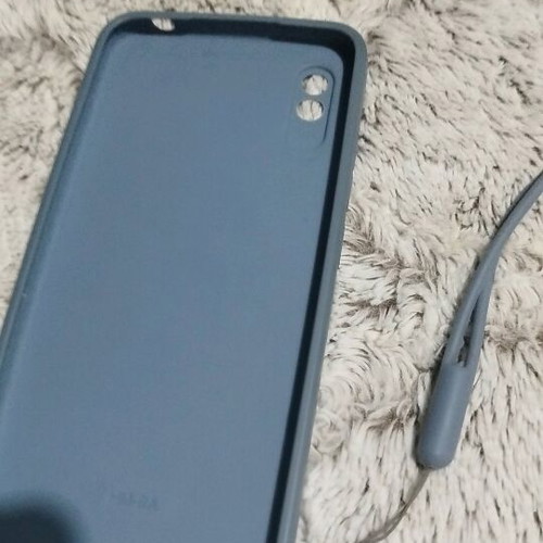 Redmi 9a case used, blue with silicone daisies