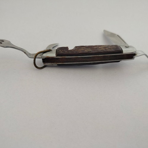 Vintage pocket knife with integrated fork and spoon, used