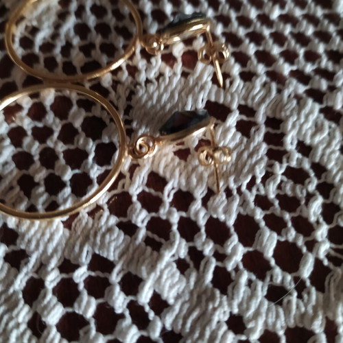 Earrings like new gold-colored stainless steel with black stones