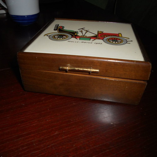 Wooden box used with car illustration on ceramic tile