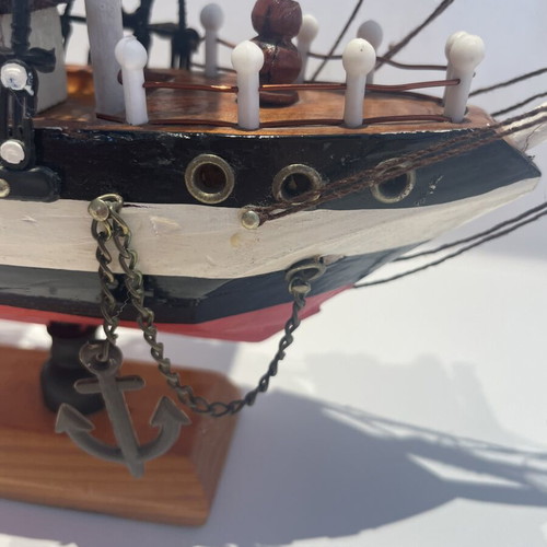 Vintage wooden decorative ship like new with striped sails and wooden base