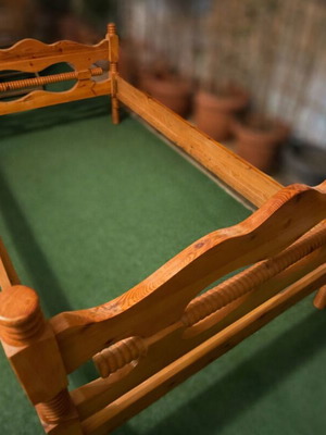 Classic wooden bed with carved details