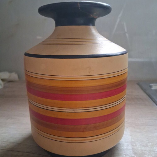 Clay vase used with repaired neck