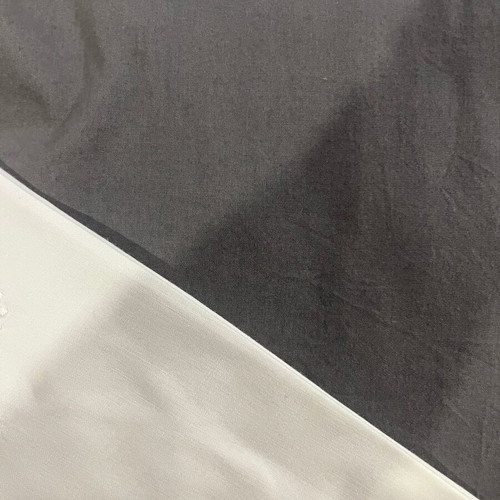 Single bed sheet set with grey fitted sheet and white embroidered pillowcase