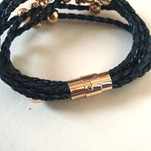 Black braided bracelet with gold beads and crystal clover like new