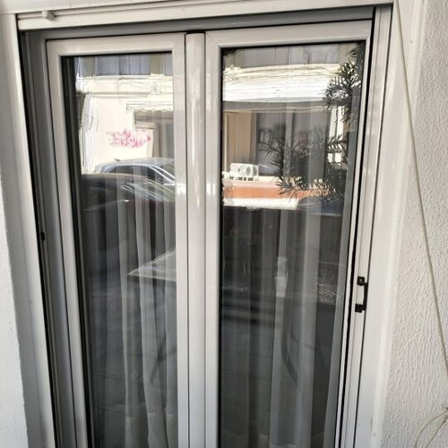 Aluminum frames used, two balcony doors and three windows with shutters and screens