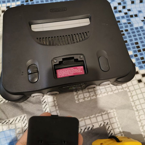 Nintendo 64 console used with jumper pack, power supply, cables, and two faulty controllers
