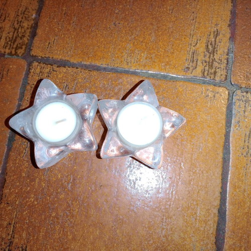 Solid glass embossed star candle holders used