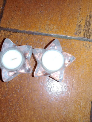 Solid glass embossed star candle holders used