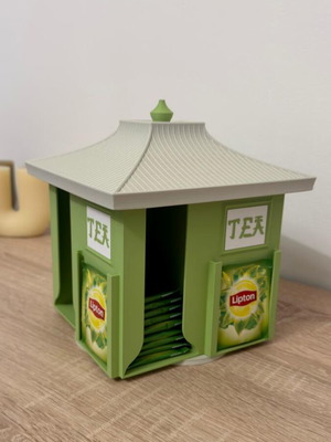 Rotating tea organizer base like new with 4 columns