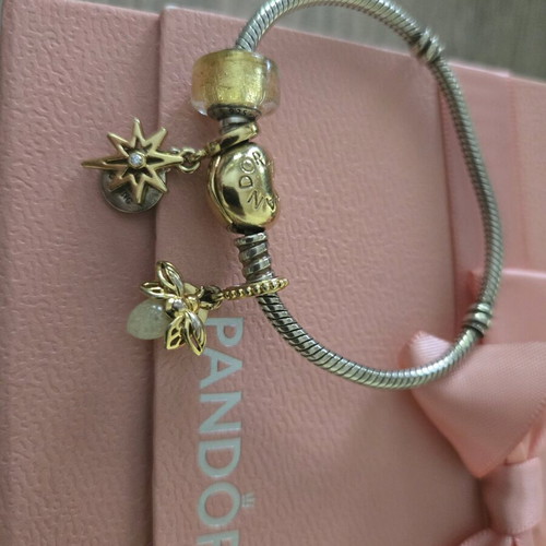 Pandora authentic bracelet like new with 3 gift charms silver and gold