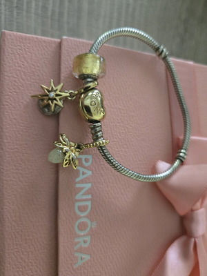 Pandora authentic bracelet like new with 3 gift charms silver and gold