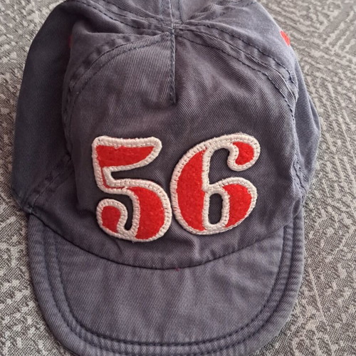 Grey baby hat with red embroidered number 56 like new