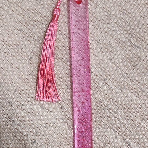 Handmade pink resin bookmark with glitter and tassel