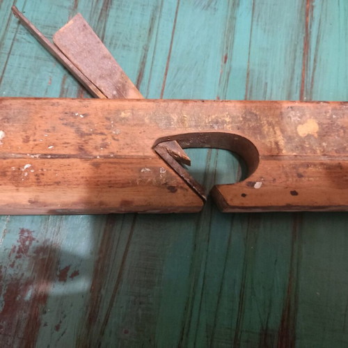 Wooden plane used with signs of wear, about 25 centimeters