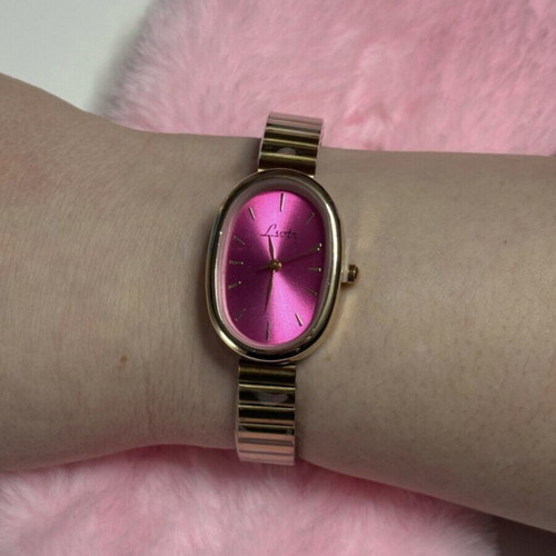 Gold watch with fuchsia dial like new, women's