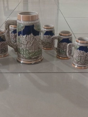 Ceramic beer mug with 6 small mugs like new