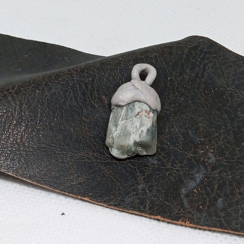 Pendant made of natural stone and polymer clay, tribal style