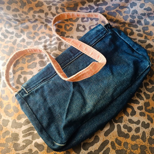 Denim handbag used with pink details