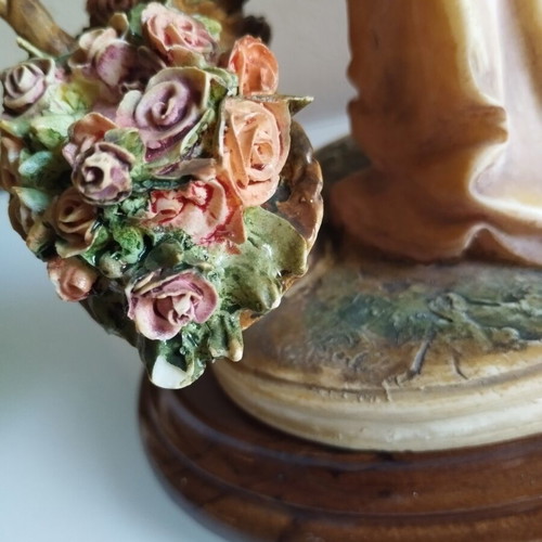 Vintage Italian decorative statue of a girl with roses, used