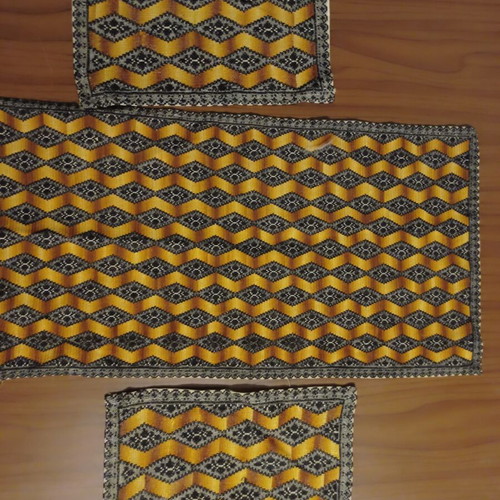 Handmade embroidered table linen set with 3D optical design
