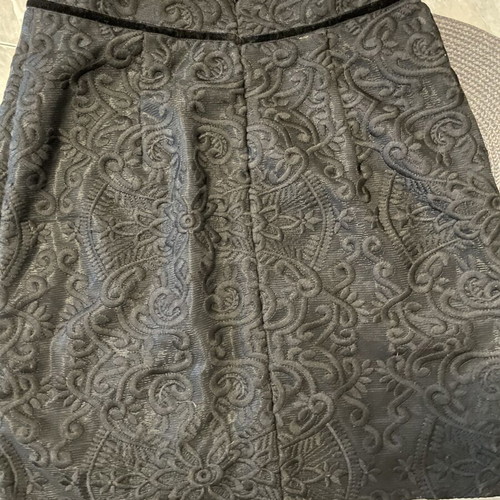 Zinas black mini pencil skirt made of embossed brocade fabric