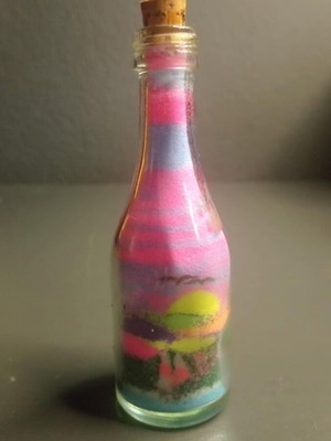 Glass bottle with colored sand used