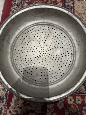 Vintage copper colander used, traditional folk art