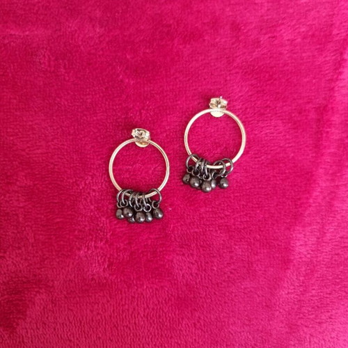 Gold-plated hoop earrings with hanging details like new