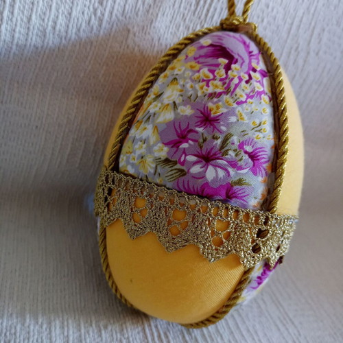 Decorative yellow floral egg used for Easter and spring decor
