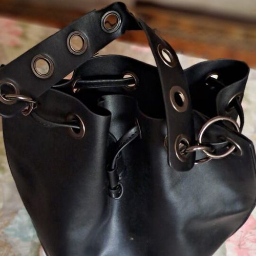 Pink Woman black bucket bag used, soft faux leather with metal details