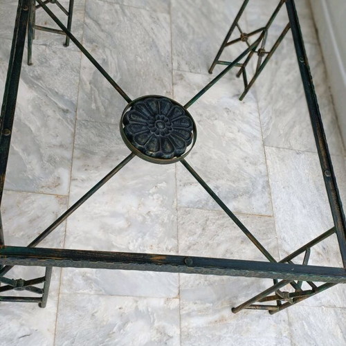 Metal table used with ceramic decoration and antique finish