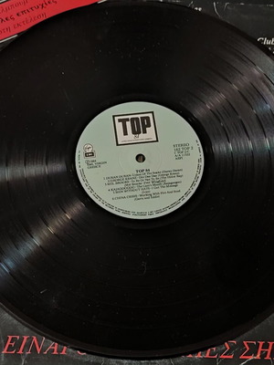 84 Top Hits Vinyl Record used with scratches