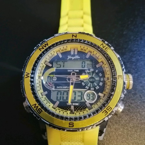Watch with yellow strap missing one button, works