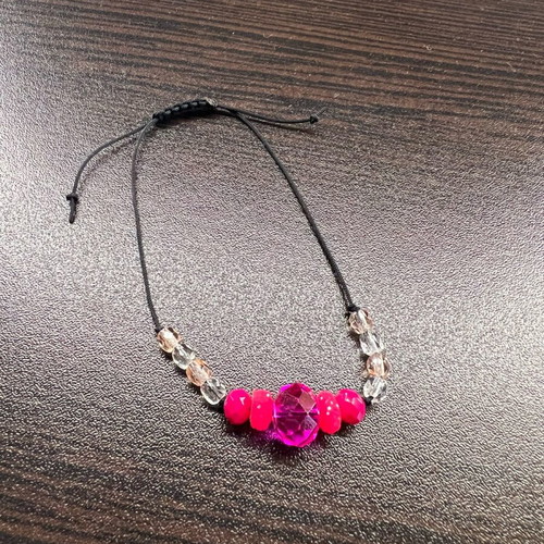 Bracelet with pink beads and cord new