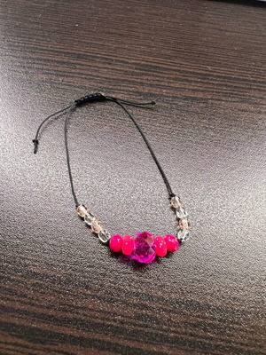 Bracelet with pink beads and cord new